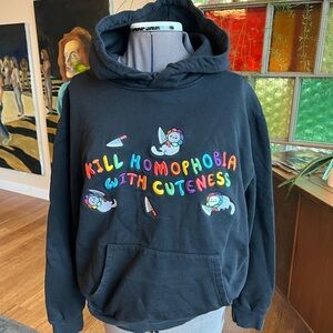 Unisex Paws of Pride “Kill homophobia with cuteness” embroidered sweatshirt